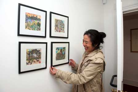 artist with her paintings