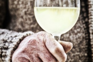 Holding a glass of wine