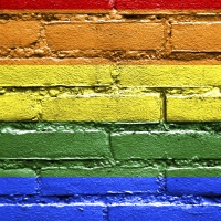 Rainbow Flag painted on brick wall