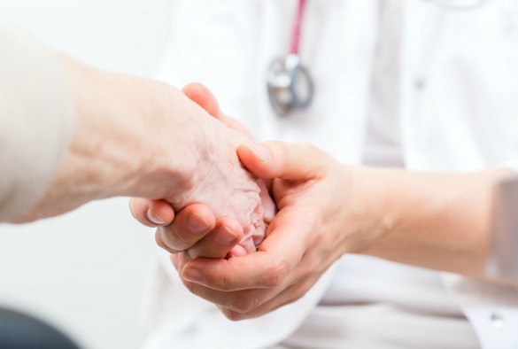 Dr holding the hands of a patient