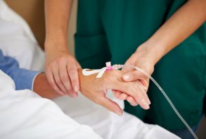 nurse giving patient treatment