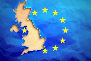 Piece in form of UK borders torn out from the flag of the European Union. United Kingdom withdrawal from the European Union. Brexit concept
