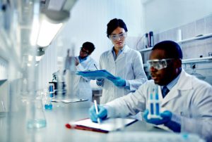 oung scientists analyzing substances in laboratory