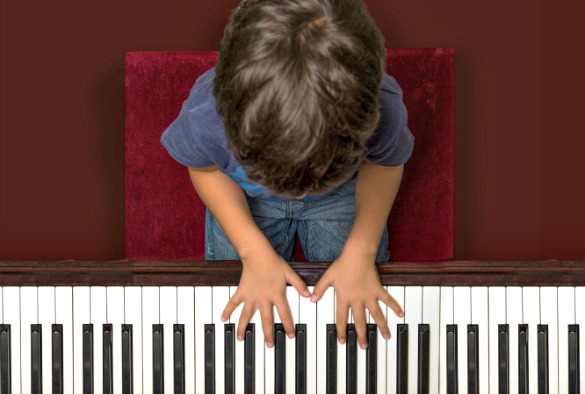 Child playing a piano