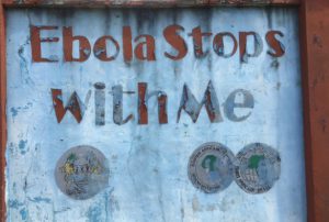A faded Ebola warning sign in Freetown, Sierra Leone
