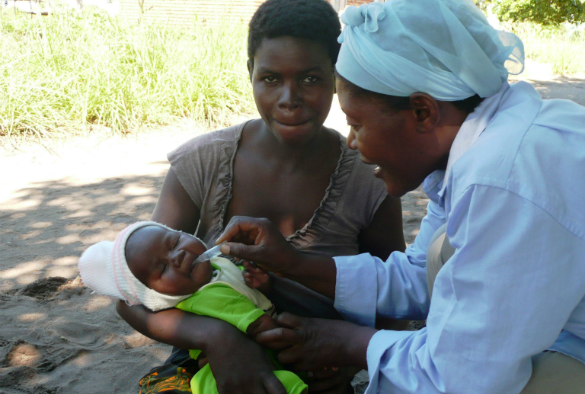 baby being given an orla rotavirus vaccine in Malawi