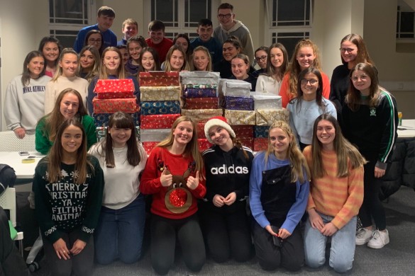 The Gaelic Football club group members with Christmas shoeboxes