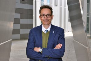 Professor Tom Solomon stood outside of a laboratory building