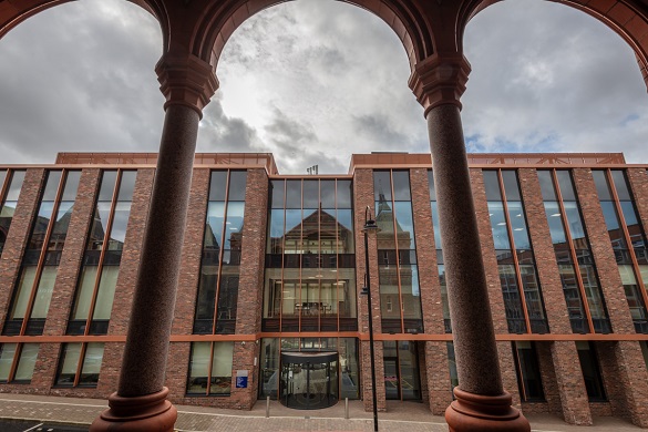 Full width red brick and glass exterior of the Digital Innovation Facility building