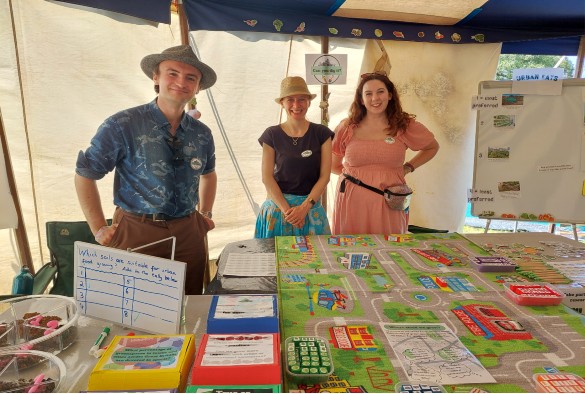 The Can You Dig It team at their stall inside Glastonbury tent