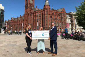 Prof Gavin Brown presents a cheque to Kimberly Gardner and Val O'Donnell from YPAS