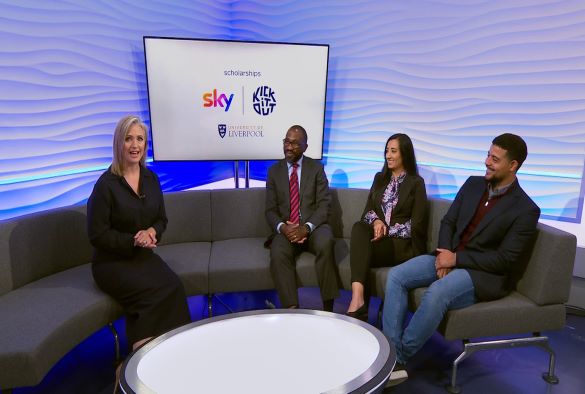 Two scholarship holders, their teacher and a TV presenter sat on a sofa