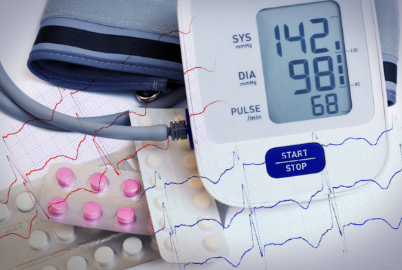 automatic blood pressure meter and pills in blister packs