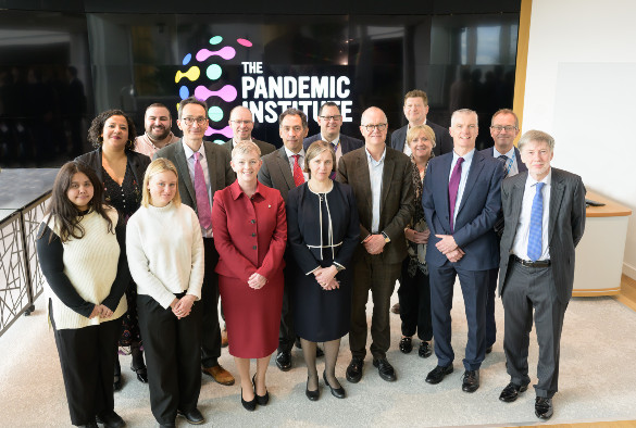 A group photo of Sir Patrick Vallance and Professor Lucy Chappell with attendees from The Pandemic Institute and partner organisations.