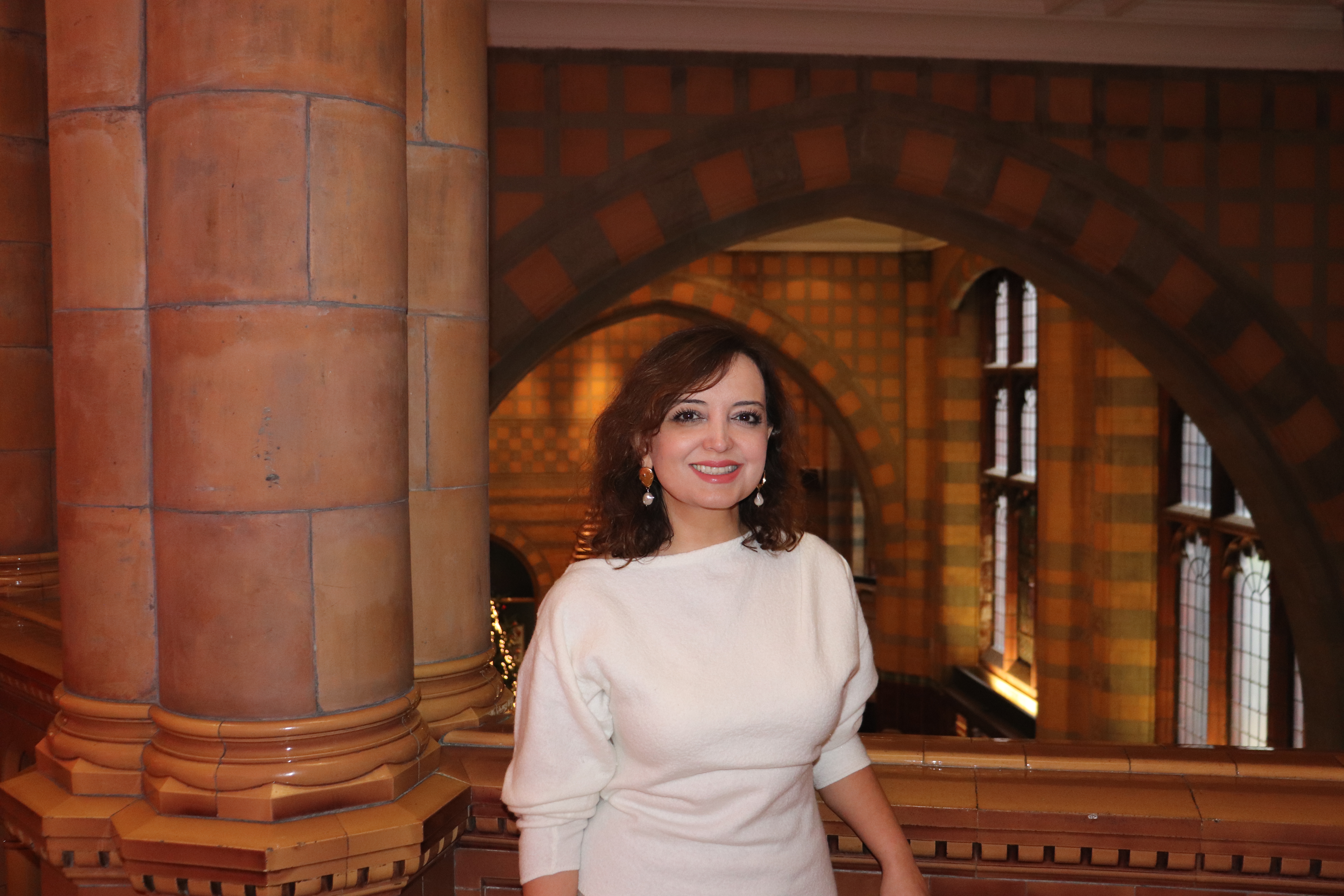 Dr Esmita Charani standing in the University's Victoria Building