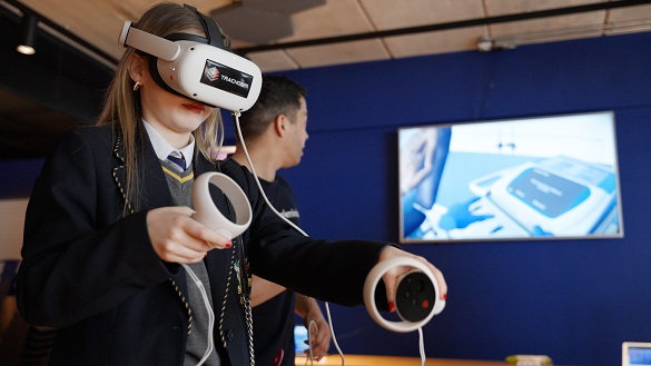 Image of a schoool child trying VR headset out at the Aortic Futures event