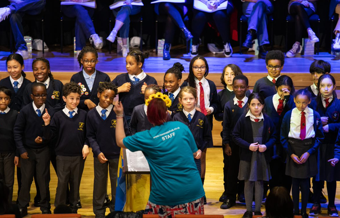 A choir of children being conducted
