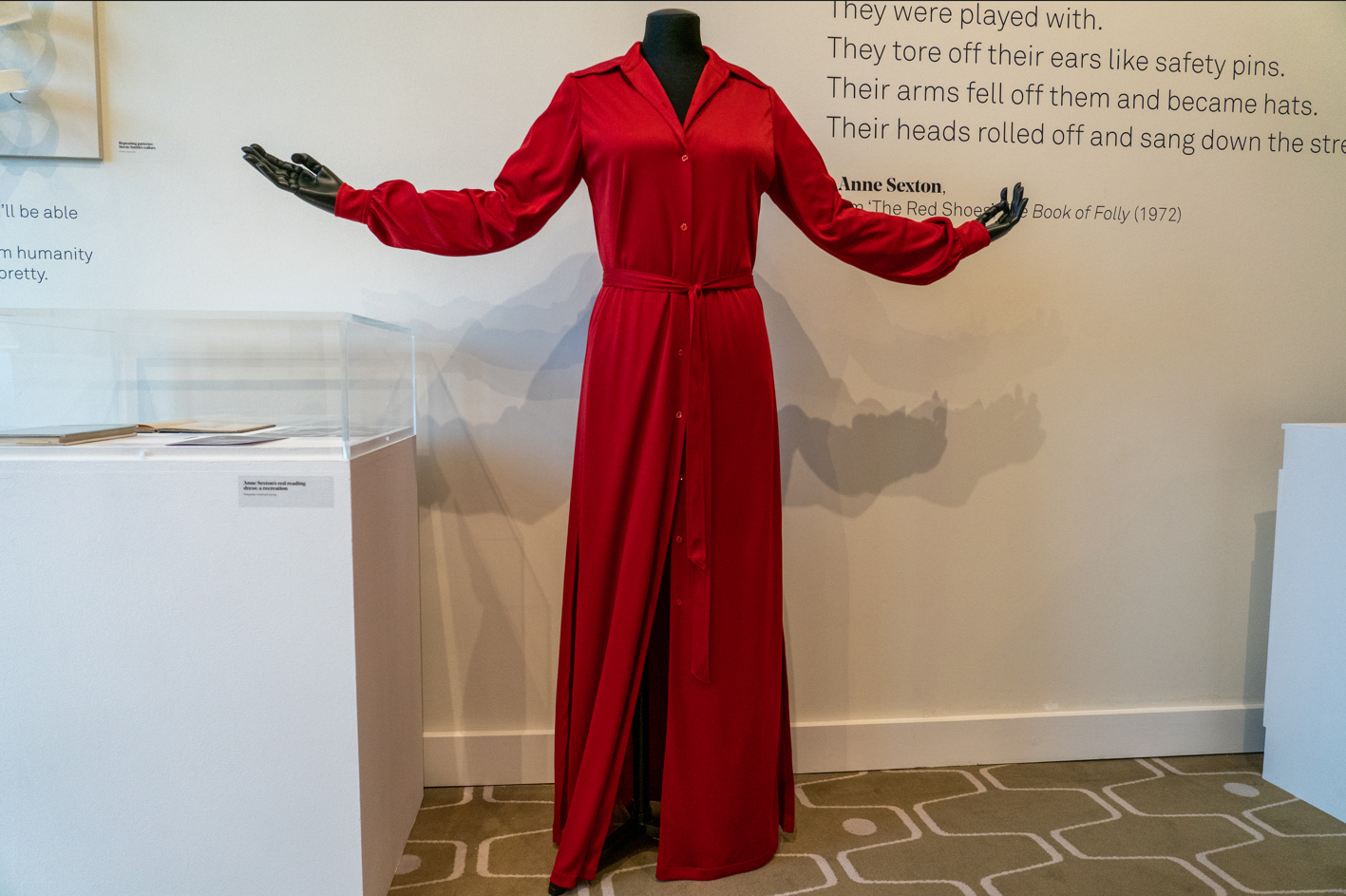 A picture of a mannequin wearing a red dress