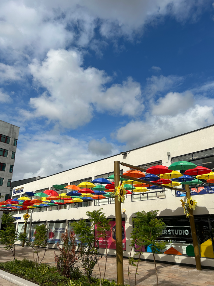 A picture of coloured umbrellas at University Square