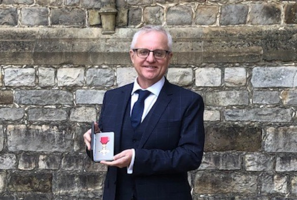 Professor Nigel Cunliffe with his OBE medal