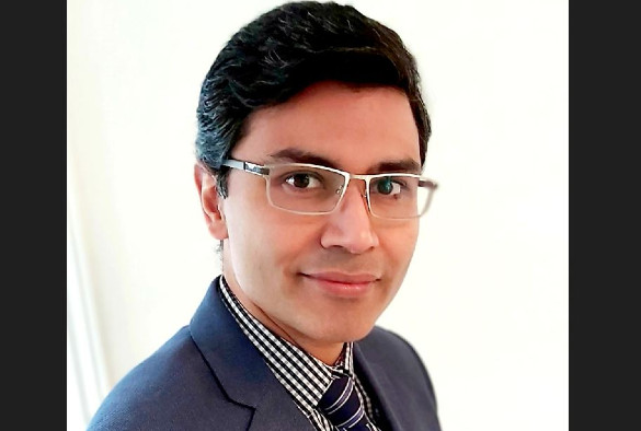 A headshot of Prof Mukherjee