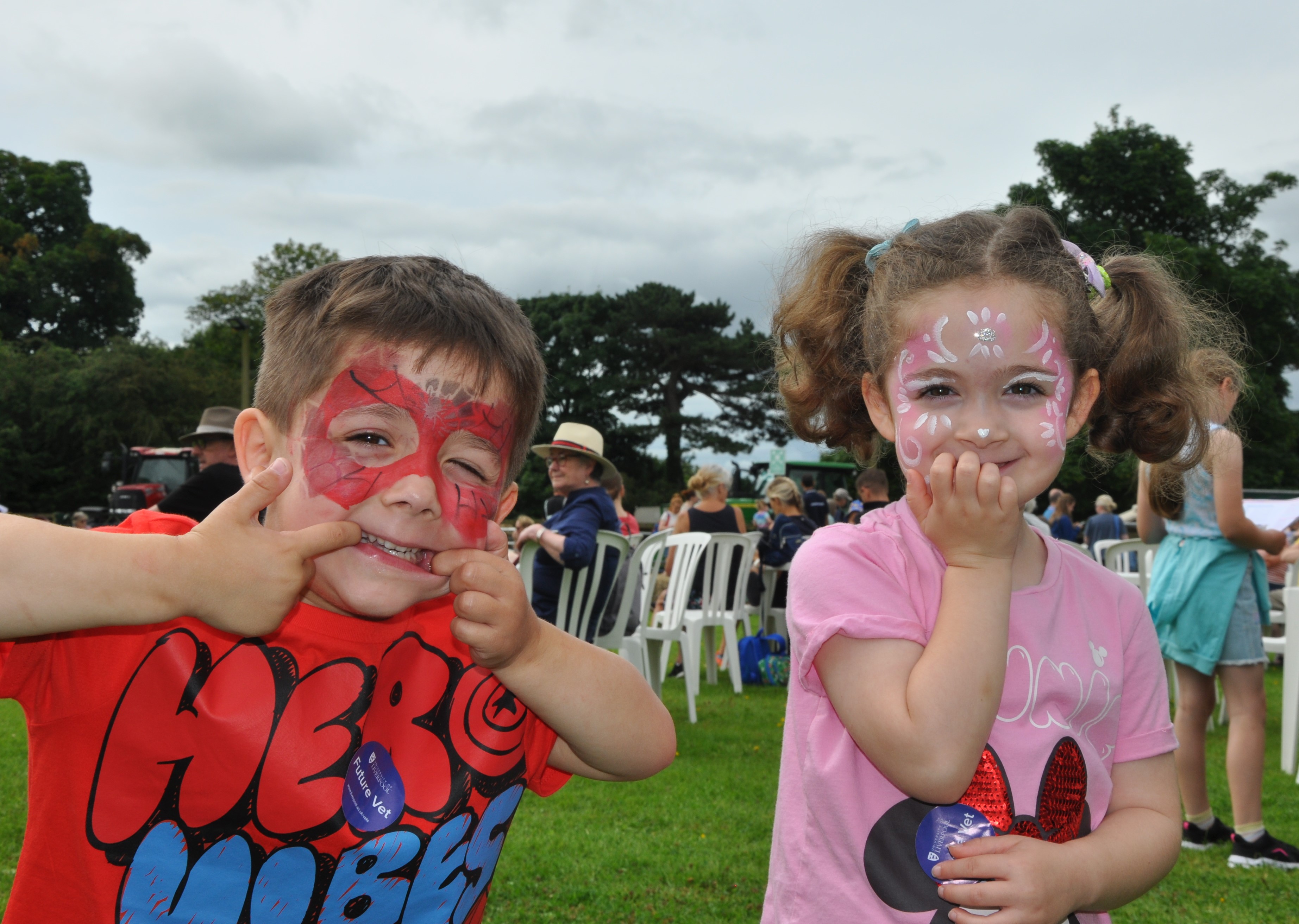 A couple of children with their faces painted