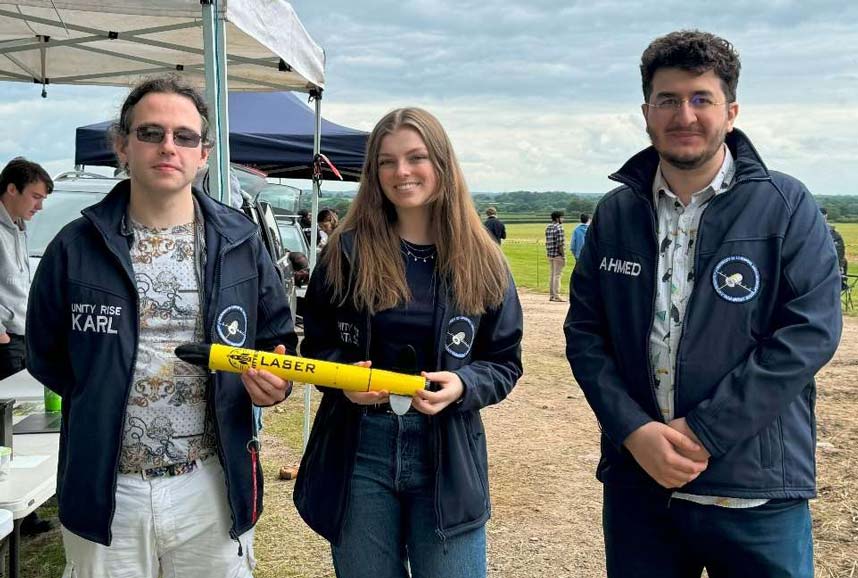 Student LASER group with rocket