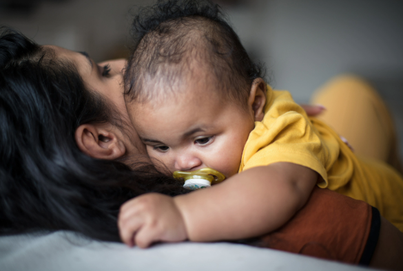 Small baby with mother