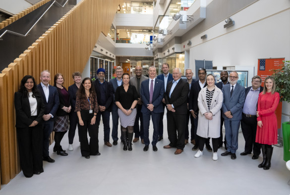 Standing group shot of University and Roche colleagues. 