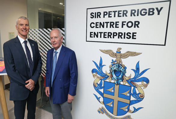 University of Liverpool Vice Chancellor and Sir Peter Rigby standing next to signage saying Sir Peter Centre for Enterprise