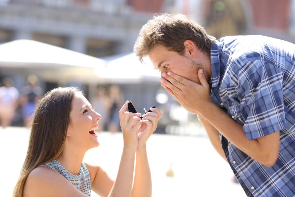 A woman proposing to a man