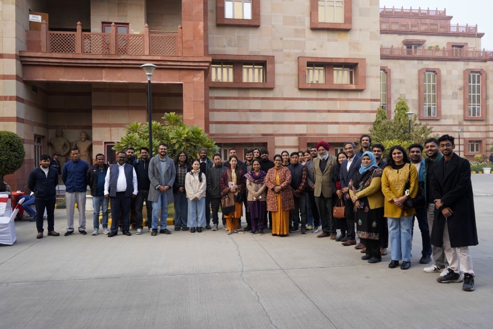 Symposium attendees standing outside The Indian Institute of Heritage building