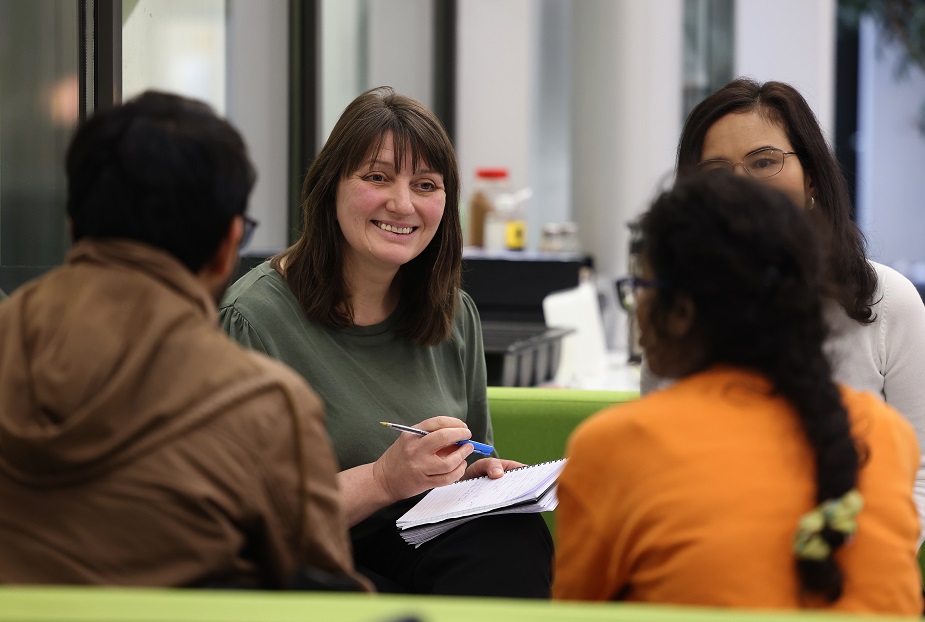 Staff talking to students