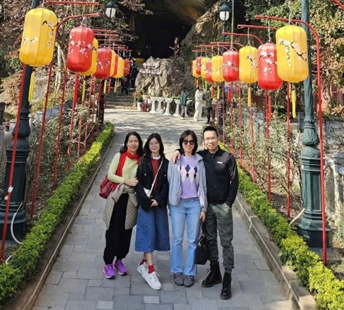 Students standing in between celebration lanterns