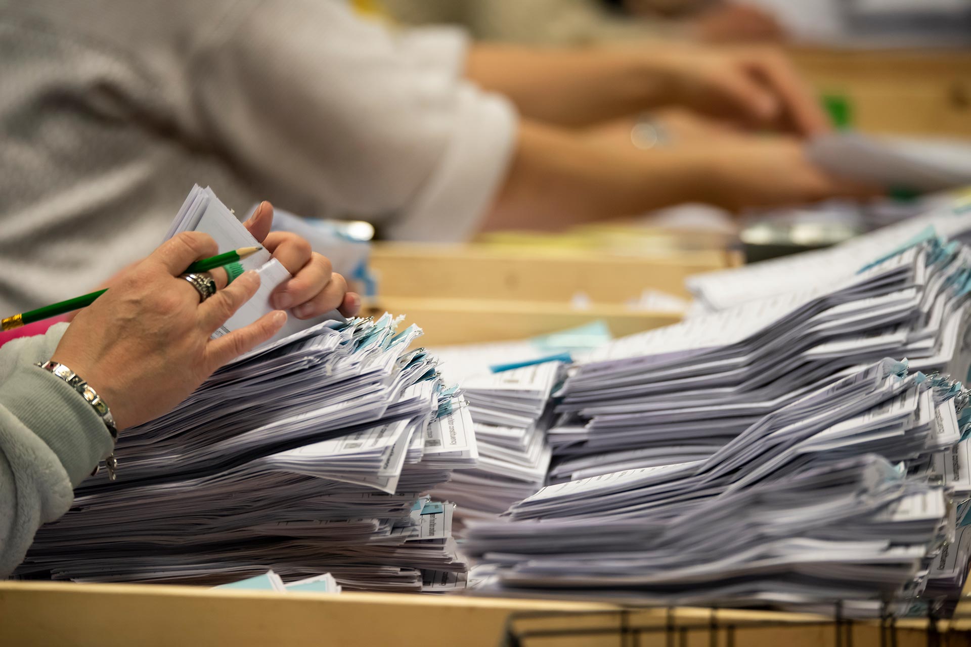 A close up of ballot papers being counted during an election
