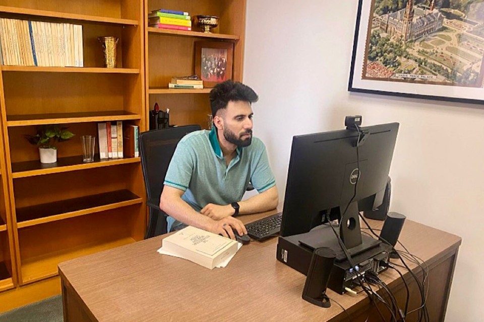 Researcher sitting at computer working
