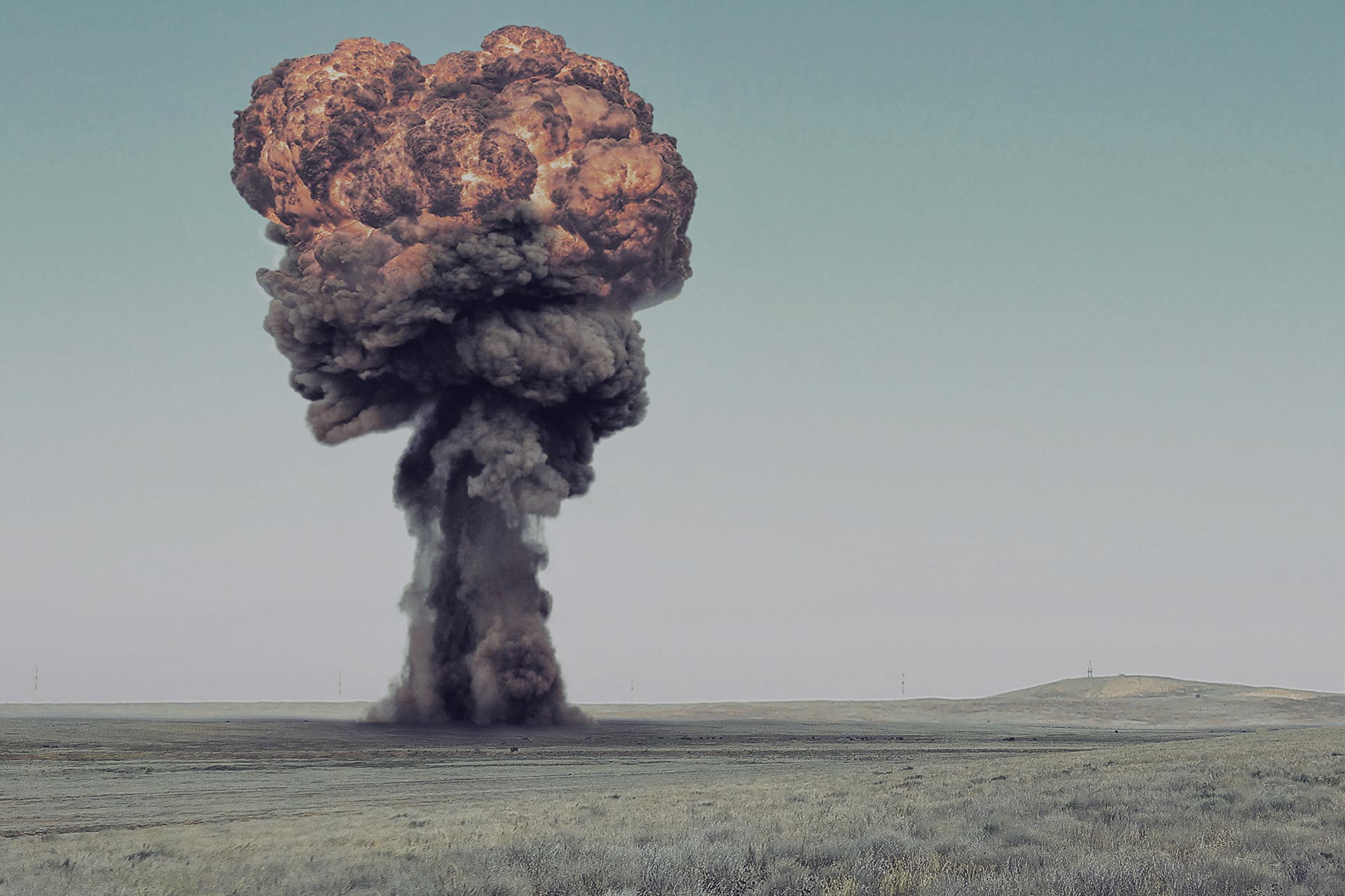 Explosion, nuclear bomb test in a deserted steppe